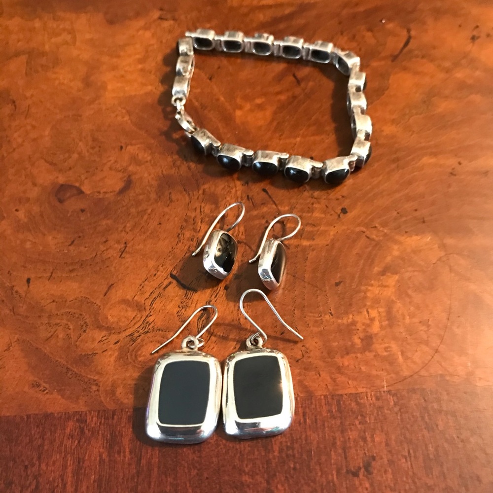 Black onyx and silver bracelet & 2 sets earrings.